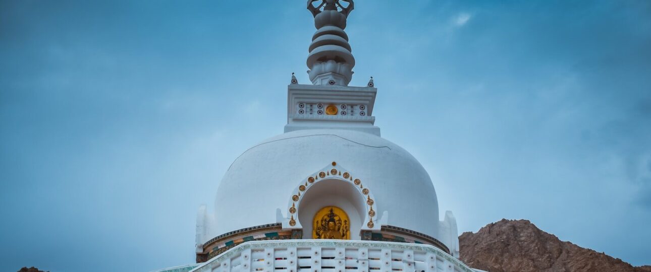 a large white building with a clock on top of it
